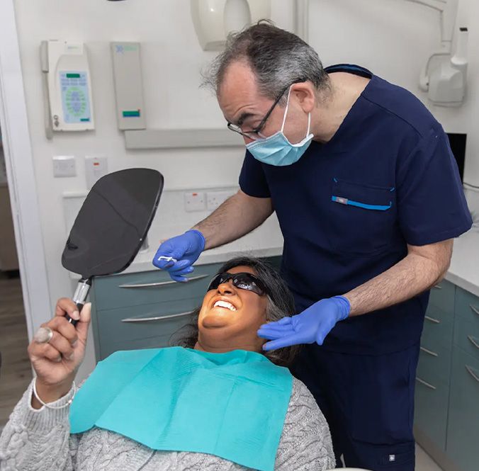 A clinician treating a patient at Ethicare Dental